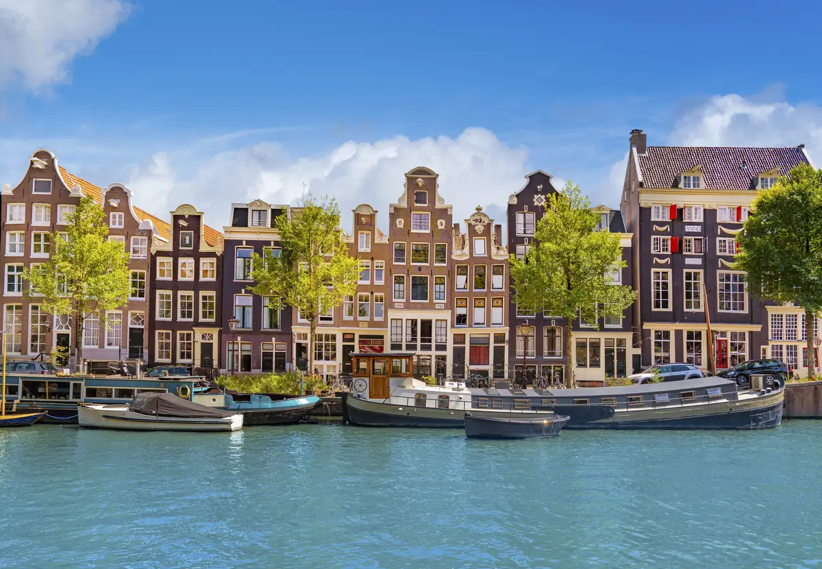 Gabled canal houses and houseboats in Amsterdam