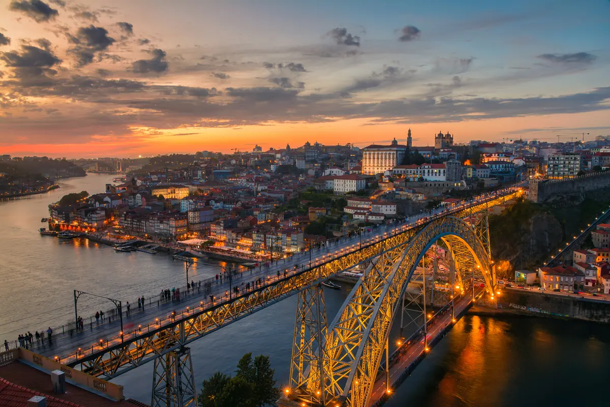 Dom Luís I bridge and Porto's Ribeira district at sunset