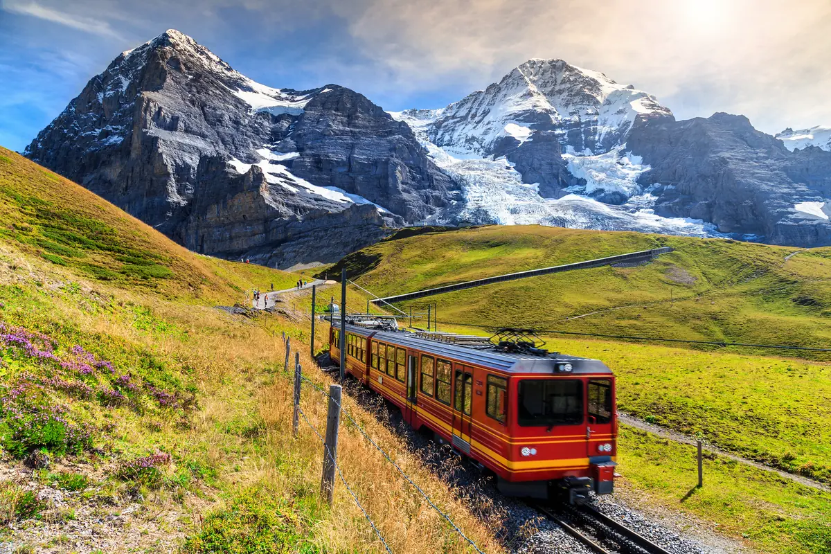 Red mountain train below the Eiger and Mönch in the Jungfrau region