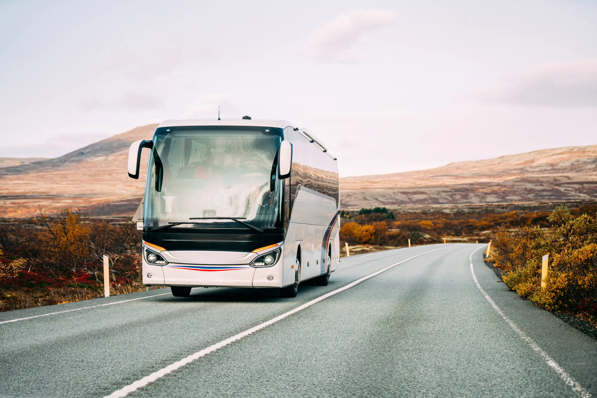 Tour coach on an open mountain road